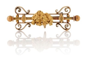 GEORGE RICHARD ADDIS of Kalgoorlie Western Australia, 15ct yellow gold bar brooch, set with an impressive pure gold nugget specimen, 19th/20th century, 5.5cm wide, 10.1 grams