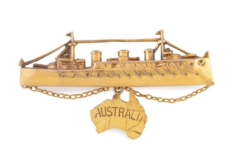 H.M.A.S. AUSTRALIA 9ct yellow gold brooch showing the famed battlecruiser with Australian map suspended beneath, circa 1913. Made by WILLIS & SONS of Melbourne. Stamped "9.W." with unicorn mark. ​​​​​​​4.5cm wide, 2.4 grams 