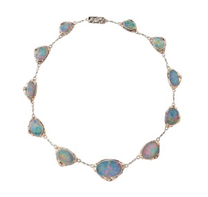 RHODA WAGER (attributed) sterling silver necklace with eleven graduated opal doublets with rose gold highlights, circa 1930, stamped "CURIO SHOP, 76 CASEY ST.", 37cm long