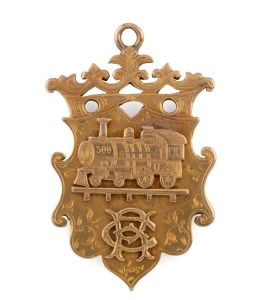 NORTHERN RAILWAY (Queensland) antique 15ct yellow gold fob adorned with a locomotive and monogram, engraved verso "To R. CAMPRADT From His Comrades Of The NORTHERN RAILWAY On His Departure From TOWNSVILLE, March 1901, stamped "KEELING, 15ct", 5cm high, and an impressive weight of 22.5 grams