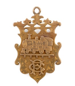 NORTHERN RAILWAY (Queensland) antique 15ct yellow gold fob adorned with a locomotive and monogram, engraved verso "To R. CAMPRADT From His Comrades Of The NORTHERN RAILWAY On His Departure From TOWNSVILLE, March 1901, stamped "KEELING, 15ct", 5cm high, an