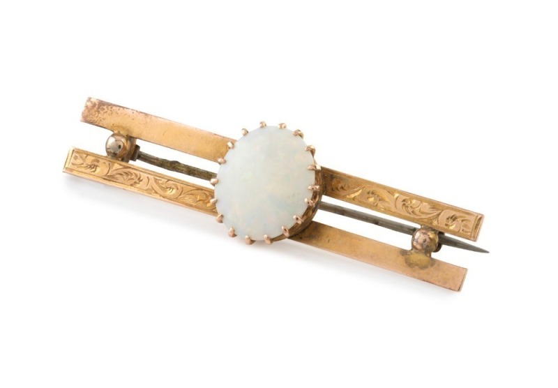 An antique 9ct yellow gold Australian bar brooch, set with a large solid polished opal, 19th century, stamped "9ct" with lion mark, ​​​​​​​5.2cmwide, 5 grams