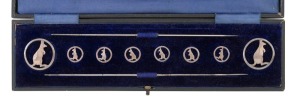 An antique sterling silver Australiana kangaroo hatpin and button set in original plush fitted box, made by Deakin & Francis of Birmingham, circa 1912, the box 27cm wide