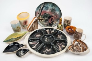 Australiana factory ceramics, mostly mid 20th century with hand decorated Aboriginal and Australian themes, (12 items), the largest platter 39cm across the handles