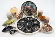 Australiana factory ceramics, mostly mid 20th century with hand decorated Aboriginal and Australian themes, (12 items), the largest platter 39cm across the handles