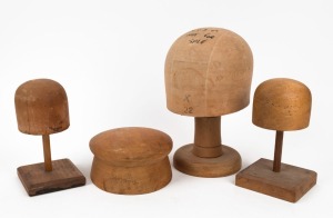 Four assorted timber hat blocks and display stands, 20th century, the largest 26cm high