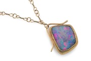 An Australian modernist 18ct yellow gold and opal pendant suspended on 18ct yellow gold chain, stamped "E.S. 750", the pendant 5cm high, the chain 52cm long, the chain 15 grams, 33 grams total