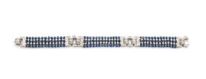 An Art Deco style sapphire and diamond bracelet, 18ct white gold, length 19.5cm.