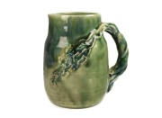 CHARLES DREW green glazed pottery jug with windswept branch handle, incised "Charles Drew", ​​​​​​​13.5cm high