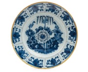 An antique English tin glazed earthenware blue floral plate with yellow border, 17th/18th century, 22.5cm diameter