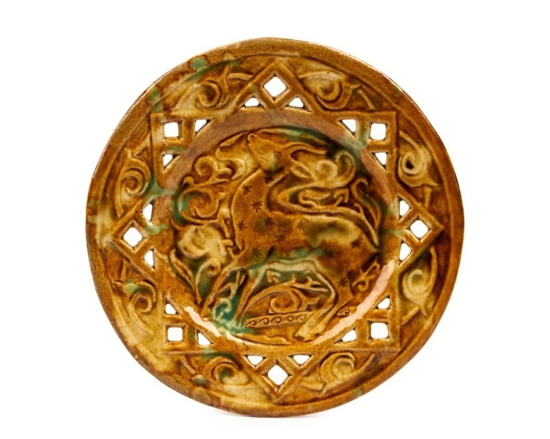 C.M.A. SIMPSON pierced pottery dish with deer decoration, glazed in brown with green highlights, incised "C.M.A. Simpson, 9th July 1949, Autumn Tints", ​​​​​​​23cm diameter