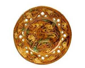 C.M.A. SIMPSON pierced pottery dish with deer decoration, glazed in brown with green highlights, incised "C.M.A. Simpson, 9th July 1949, Autumn Tints", 23cm diameter