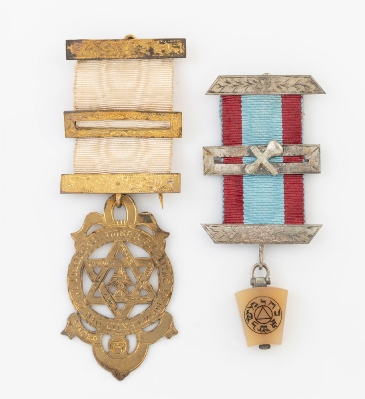 MASONIC MEDALS. Two examples, one in silver, the other silver and gilt, both in original boxes, 19th/20th century, the larger 10cm high