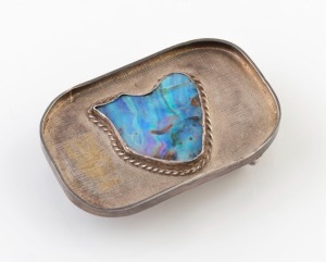 An Australian silver belt buckle inset with a large boulder opal specimen, the reverse adorned with map of Australia, 20th century, 8cm wide, 62 grams