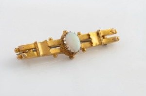 DUGGIN, SHAPPERE & Co. of Melbourne antique 15ct yellow gold brooch, set with a solid polished opal, 19th century, stamped "15" flanked by pictorial marks, 4.3cm wide, 3.1 grams