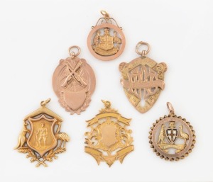 Six assorted antique gold fobs including military themes, 9ct (17.2 grams), 10ct (7.8 grams), and 15ct (5.6 grams), 30.7 grams total