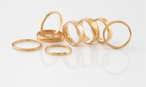 Eight assorted antique and vintage 18ct yellow gold wedding rings, mostly Australian makers, 23.4 grams total