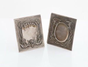 A pair of Australian Arts & Crafts silver freestanding picture frames decorated with waratahs and flannel flowers on the reverse, 20th century, stamped 925 with maker's mark (illegible), 7cm high, 84 grams