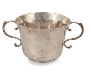An 18th century CHANNEL ISLANDS Guernsey silver christening cup with hammered base, by unknown maker, stamped "I.S.", circa 1715, inscribed "R.G.B.", 6.5cm high, 13.5cm wide, 94 grams