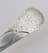 An antique CHANNEL ISLANDS bright cut silver serving spoon by GEORGE MAUGER of Jersey, circa 1810, engraved "A.E.G.T. N. 6 SEP. 1810.", ​​​​​​​20.5cm long, 46 grams - 2