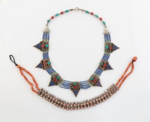 Two tribal silver necklaces, adorned with coral, lapis lazuli, turquoise and red stones, 20th century, the larger 55cm long