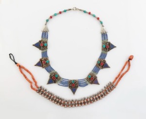 Two tribal silver necklaces, adorned with coral, lapis lazuli, turquoise and red stones, 20th century, the larger 55cm long