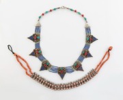 Two tribal silver necklaces, adorned with coral, lapis lazuli, turquoise and red stones, 20th century, the larger 55cm long