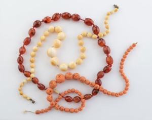 Three vintage and antique bead necklaces, including graduated ivory, carved coral, plus carnelian and bone, 19th/20th century, the ivory example 49cm long