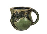 G. EVELYN M. DAVIES green glazed pottery jug with applied gumnuts and leaves, incised "G.E.M. DAVIES", 8cm high