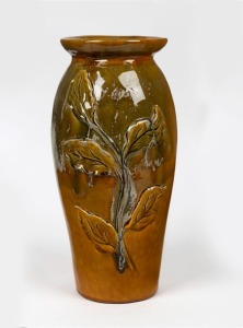 LIND tall green and brown glazed pottery vase with applied leaves, incised "E. LIND, April, 1912", 35cm high