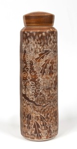 JANET De BOOS brown glazed lidded pottery vase, adorned with sgraffito banksia motif, incised "De Boos, 2015", ​​​​​​​32cm high