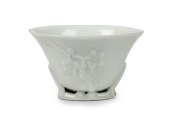 An antique Chinese blanc de chine porcelain libation cup, Kangxi period, circa 1700, ​​​​​​​5cm high, 8cm wide