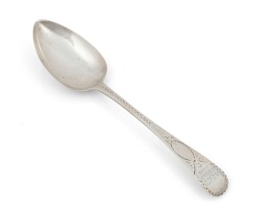 An antique CHANNEL ISLANDS bright cut silver serving spoon by GEORGE MAUGER of Jersey, circa 1810, engraved "A.E.G.T. N. 6 SEP. 1810.", 20.5cm long, 46 grams