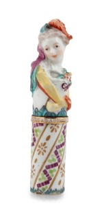An antique French porcelain and enamel figural etui sewing case, emblazoned "GAGE DE MON AMOUR" (TOKEN OF MY LOVE), with two original blued steel and gold finished needles, 18th century, 9.5cm high