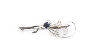 BROOCH: 18ct white gold, diamond and sapphire spray brooch.