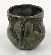 G. EVELYN M. DAVIES green glazed pottery jug with applied gumnuts and leaves, incised "G.E.M. DAVIES", 8cm high - 3