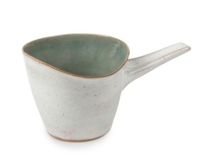 LUCIE RIE and HANS COPER cream glazed ceramic jug with celadon interior, bearing both artist's monogram marks, 7cm high, 14.5cm wide