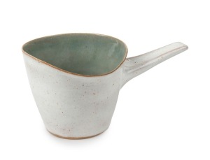 LUCIE RIE and HANS COPER cream glazed ceramic jug with celadon interior, bearing both artist's monogram marks, 7cm high, 14.5cm wide