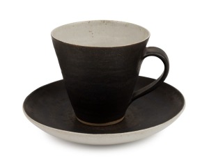 LUCIE RIE wheel-thrown teacup and saucer, stamped "L.R.", the saucer 14cm wide.
