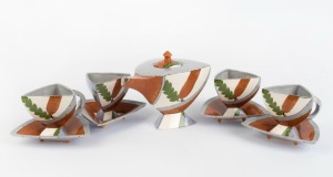 PATSY HELY "Banksia" hand-painted triangular form teapot and four matching cups and saucers, (9 items), signed "P. Hely, 1984", the teapot 15cm high