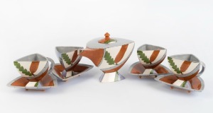 PATSY HELY "Banksia" hand-painted triangular form teapot and four matching cups and saucers, (9 items), signed "P. Hely, 1984", ​​​​​​​the teapot 15cm high