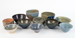 Eleven assorted studio pottery bowls, mostly glazed with blue tones, the largest 12cm high