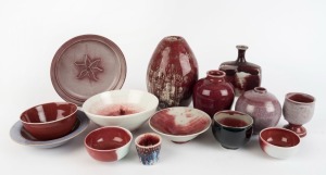 Fourteen assorted sang de boeuf and red glazed ceramic vases, bowls dishes etc 23cm high