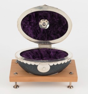 MARIKA STROHSCHNIEDER Australian silver mounted emu egg casket, mounted on Tasmanian huon pine base with additional fixed plinth, circa 2017, 12cm high overall, 30cm wide overall