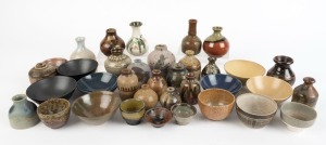 Thirty-five assorted miniature pottery vases, bowls and dishes, the largest 10cm high