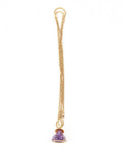 PENDANT:14ct gold mounted amethyst Buddha pendant on 18ct gold chain. 6.5 grams.