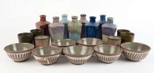 Set of eight Australian pottery bottles, set of four green ceramic beakers, set of seven pottery bowls and a pair of brown glazed beakers, (21 items), the largest 19cm high
