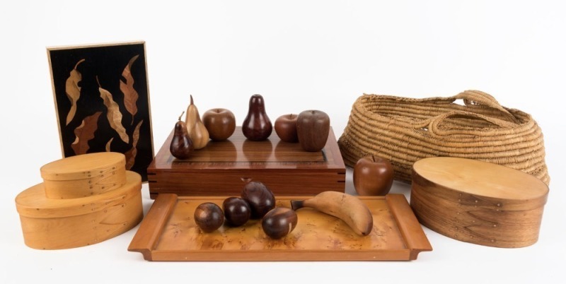 WOOD WARE including a graduated set of three Shaker style boxes, huon pine serving tray, timber boxes, turned and carved Australian timber fruit including huon pine, blackwood and sassafras, 20th century, (qty), the tray 43cm across the handles