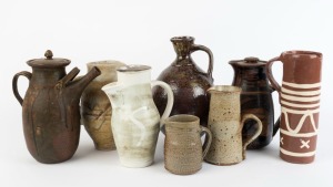 Eight assorted pottery jugs, some with lids, the largest 29cm high