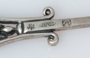 LINTON of Perth, set of 12 Australian silver spoons with wildflower motifs, 20th century, stamped "JAL. ST. SILVER", 11cm long, 152 grams total - 11